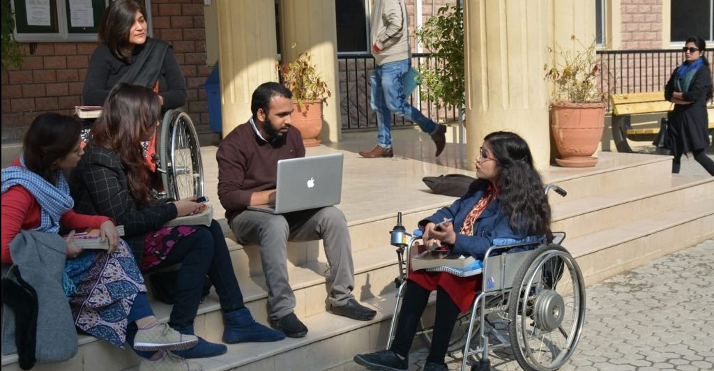 Picture of Adds Shooting in which Some Disabled persons are talking each other.