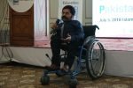 Disability Global Summit A Male Wheelchair User is Addressing on the Summit